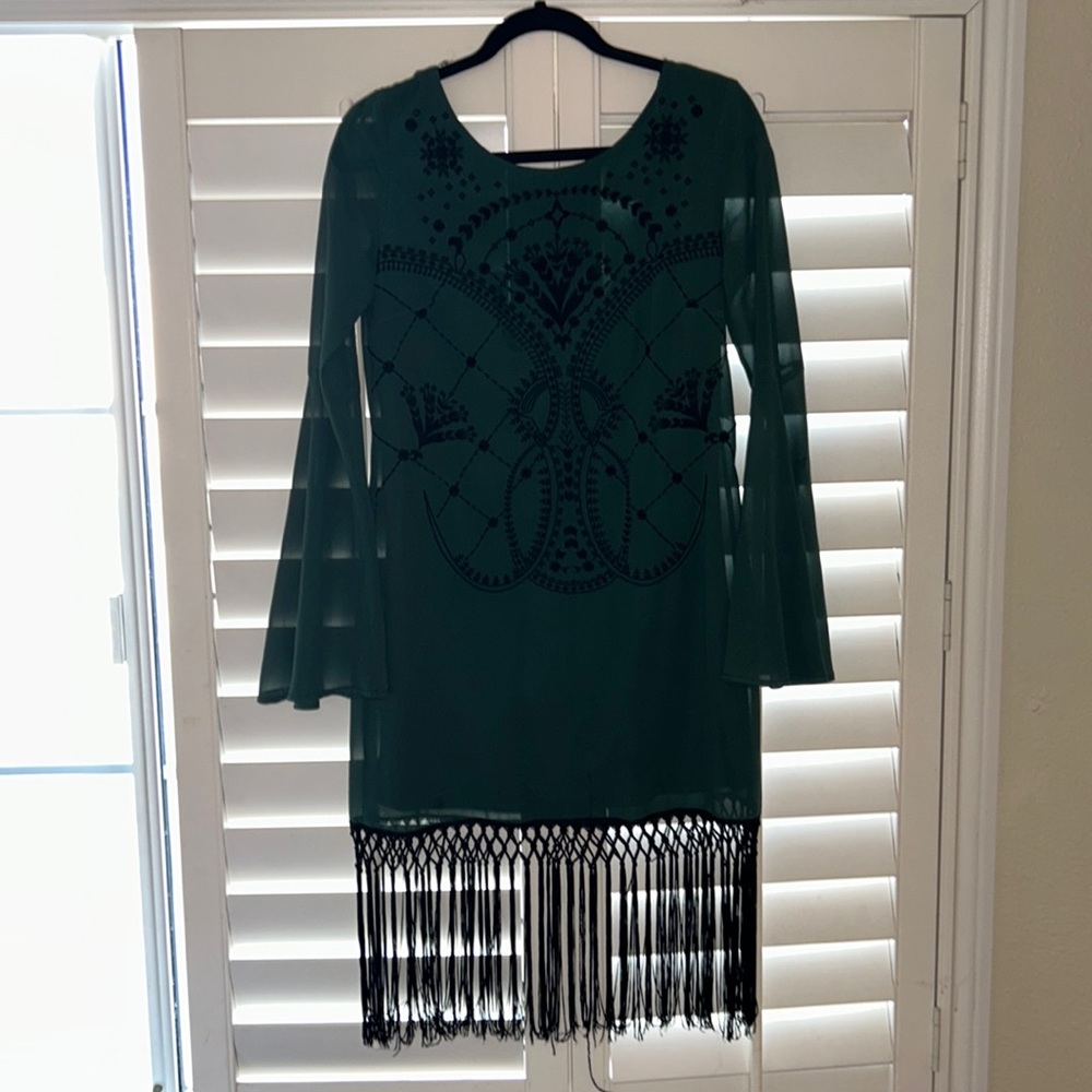 Cocktail Dress with embroidery detail and jazzy string thigh detail